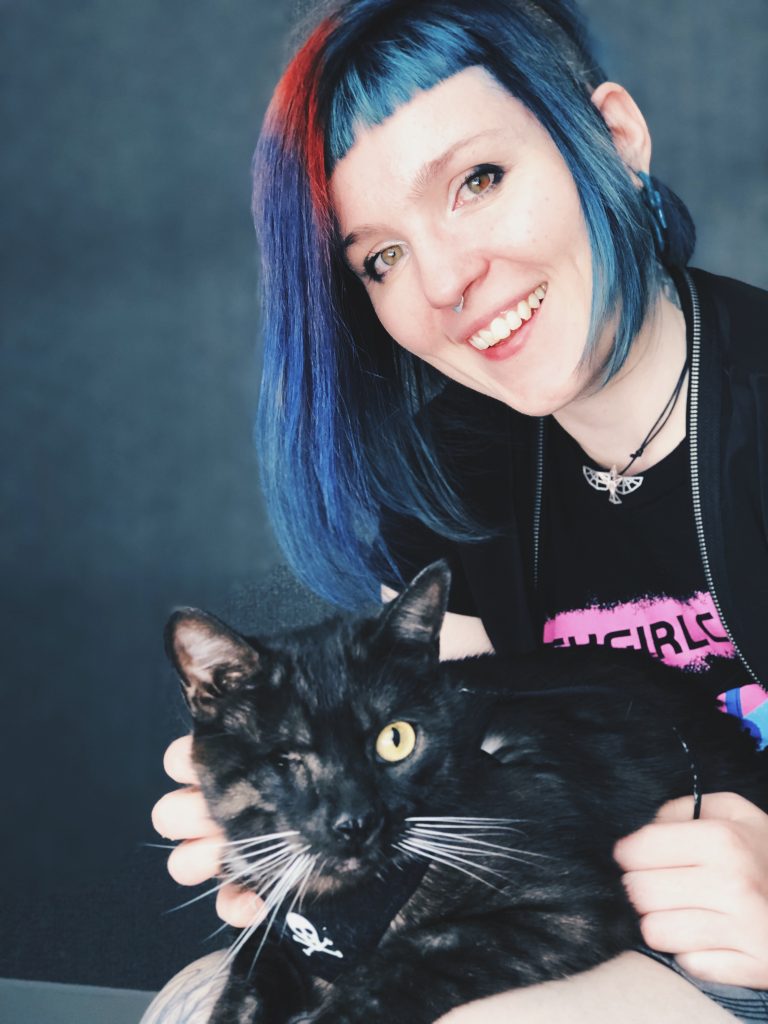 Cherry Thompson and their cat Odin